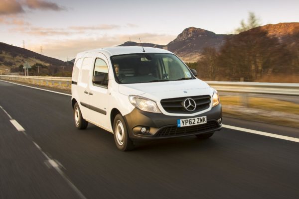 Fleet van driving down highway