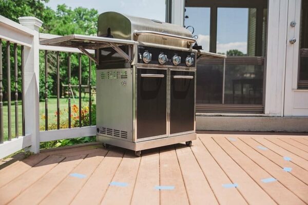 Barbeque on back porch with taped off area around it.