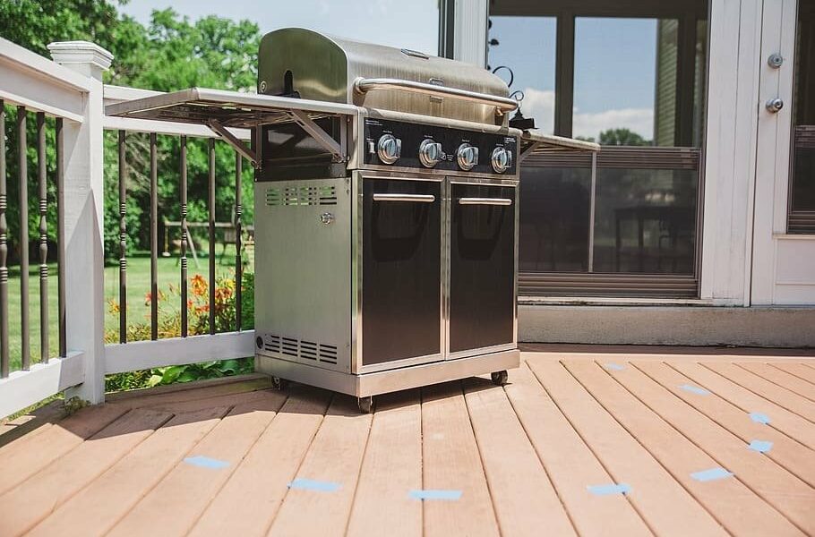 Barbeque on back porch with taped off area around it.