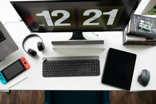 Minimal desk setup with computer, tablet & switch